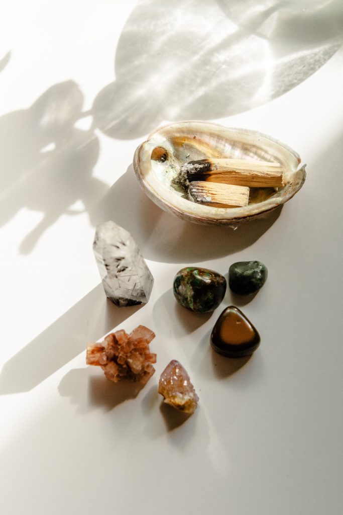 Trauma therapy image of stones and palo santo